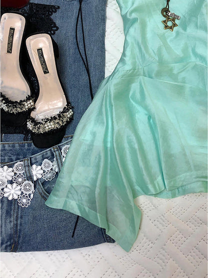 Mint green sleeveless mini dress with layered, flared irregular skirt