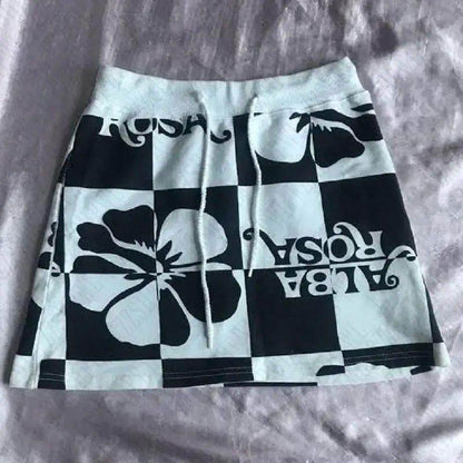 Black-and-white checkered mini skirt with bold floral graphic