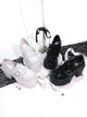 Chunky block-heel platform Mary Janes, glossy black and white with ankle straps
