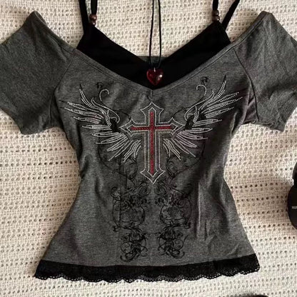 Gray off-shoulder graphic T-shirt with winged cross rhinestone print and lace trim hem