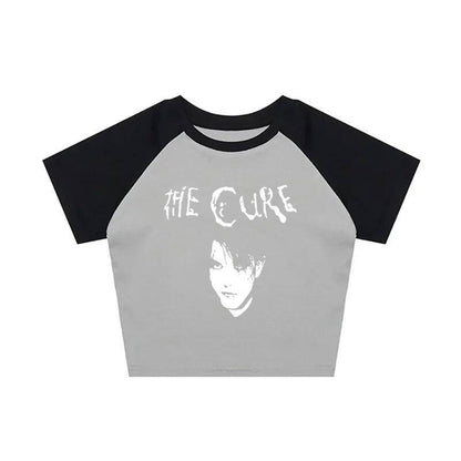 Gray raglan graphic tee with white The Cure logo and portrait print
