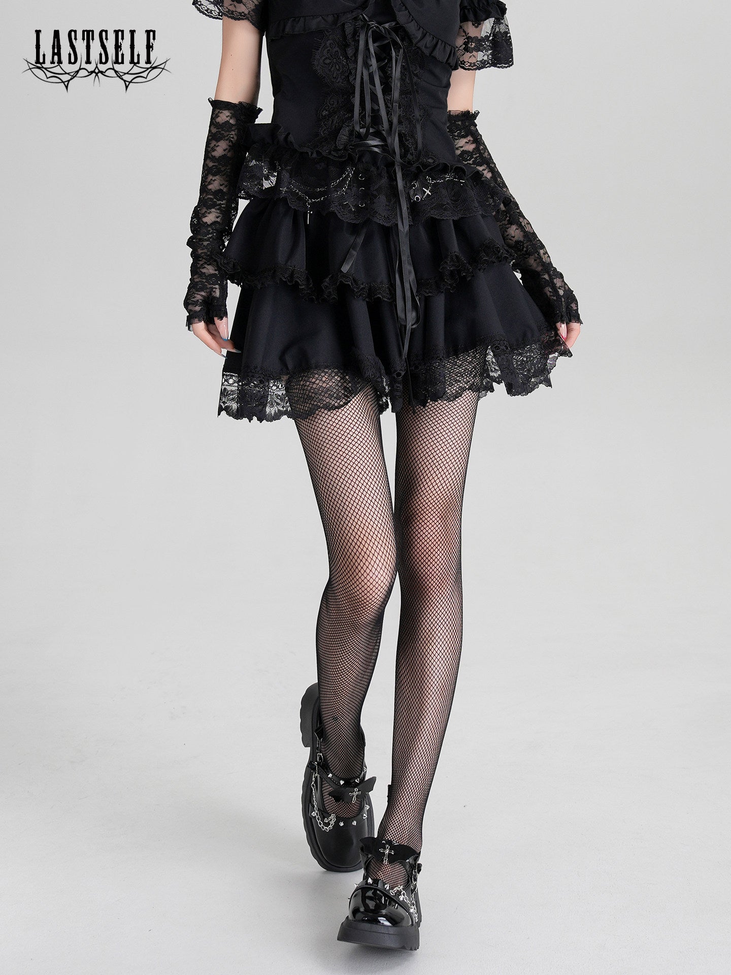 Black gothic ruffle dress with corset-lace front and layered skirt, lace sleeves