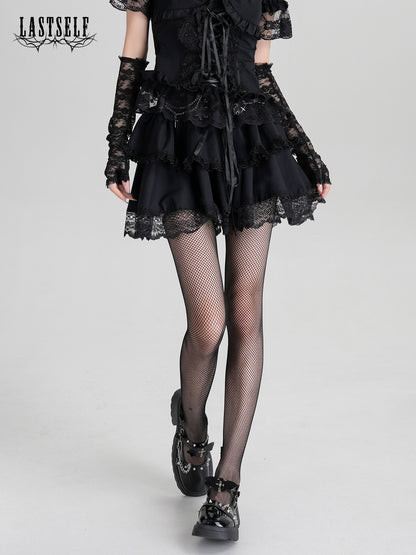 Black gothic ruffle dress with corset-lace front and layered skirt, lace sleeves