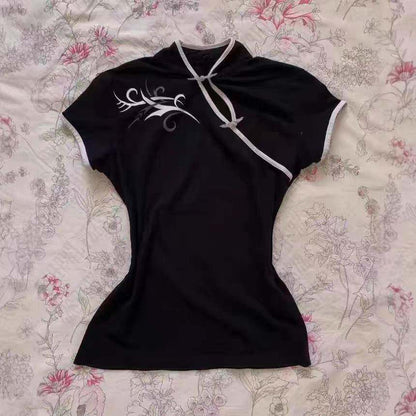 Black short-sleeve mini dress with white trim and swirl graphic at chest