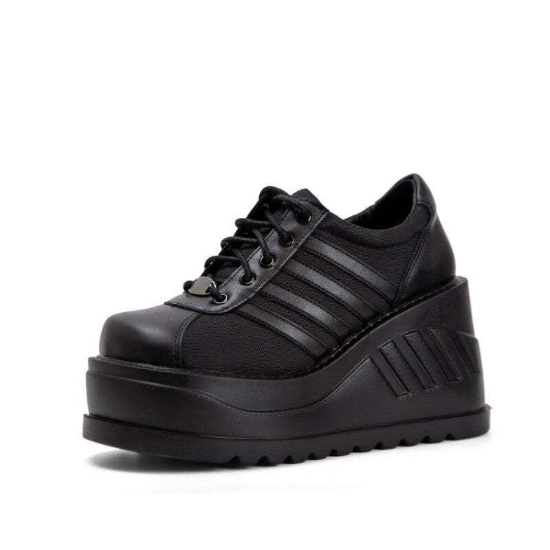Black platform lace-up sneaker with striped accents and ridged platform sole