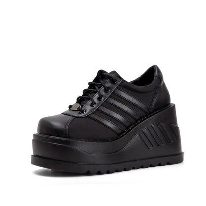 Black platform lace-up sneaker with striped accents and ridged platform sole