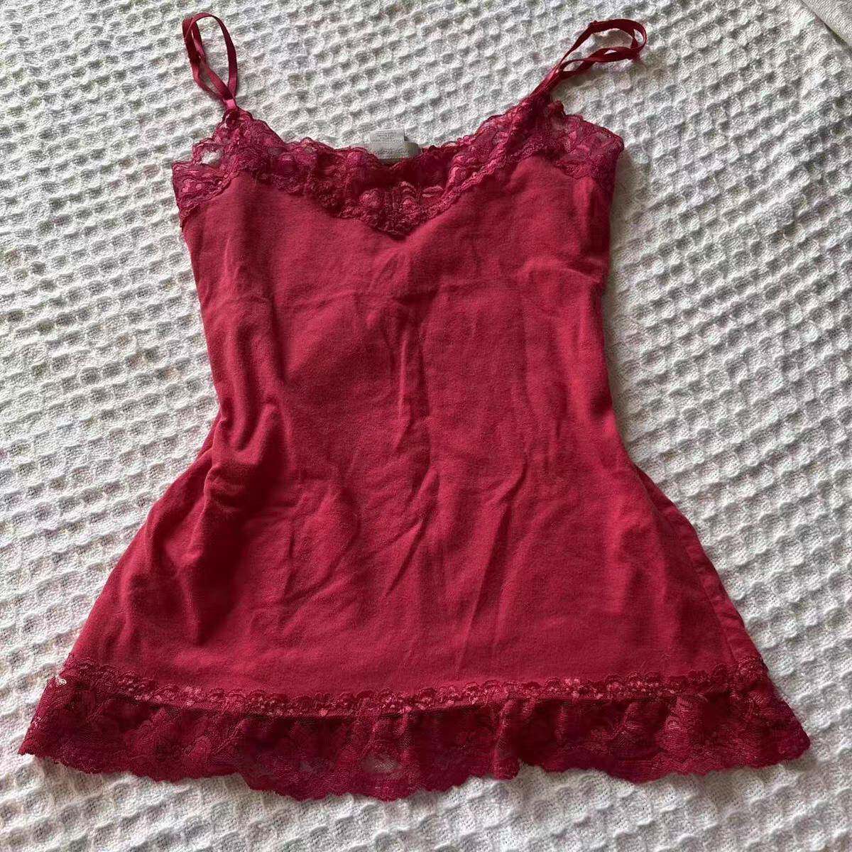 Red lace-trim slip dress with spaghetti straps and scalloped ruffle hem