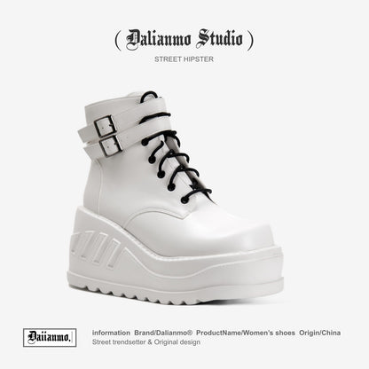 White lace-up platform boots with top buckle strap and chunky tread sole