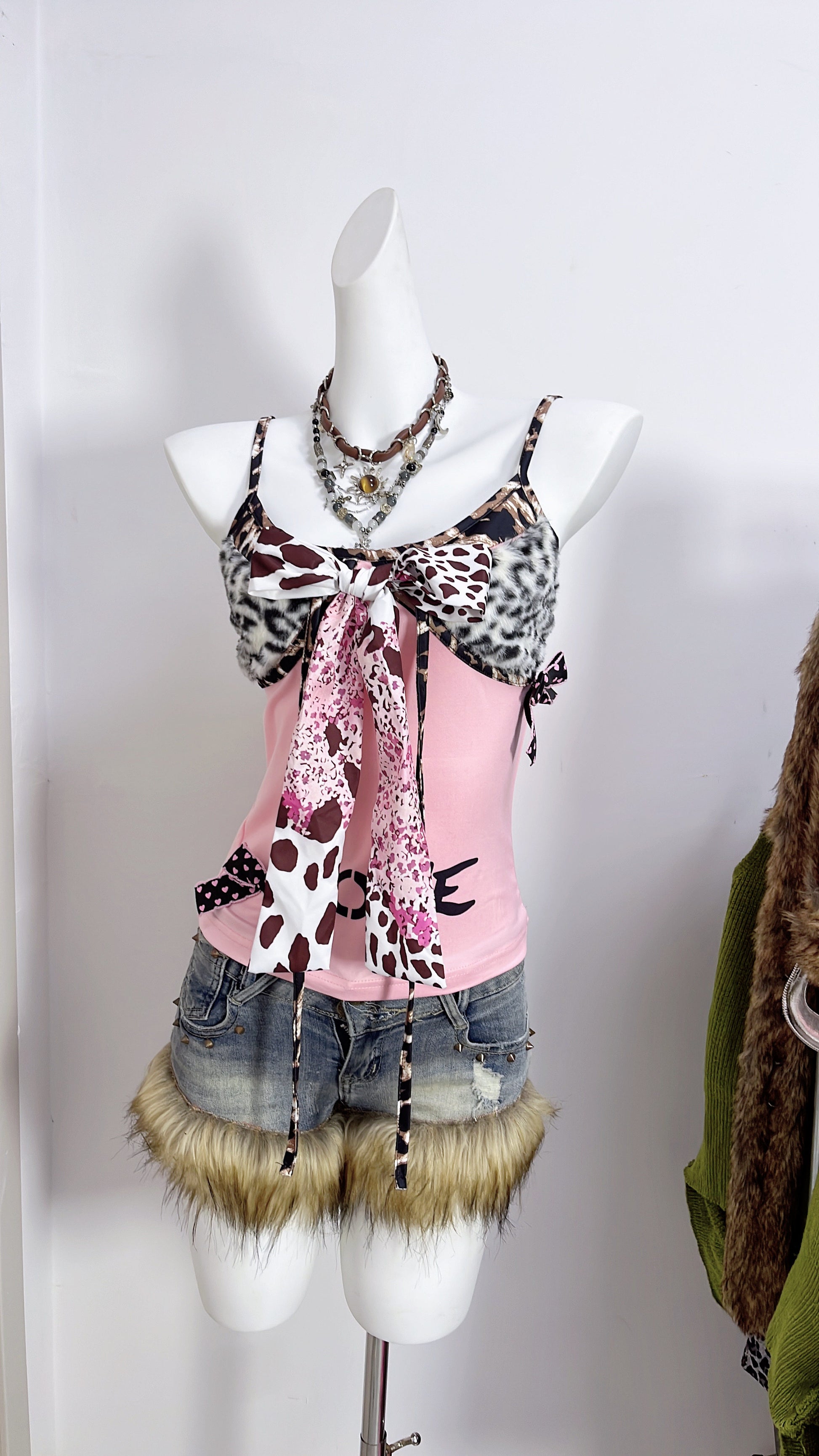 Pink patchwork camisole with leopard-print faux fur panels and bow-tied straps