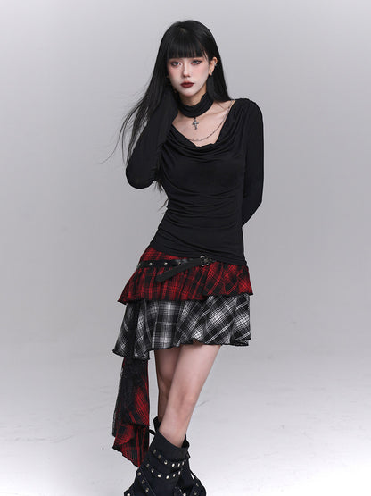 Asymmetrical plaid mini skirt with studded black waist belt and red-black, black-and-white layers