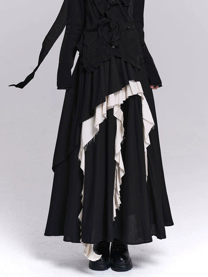 Black maxi skirt with asymmetrical tiers and layered white ruffle panels