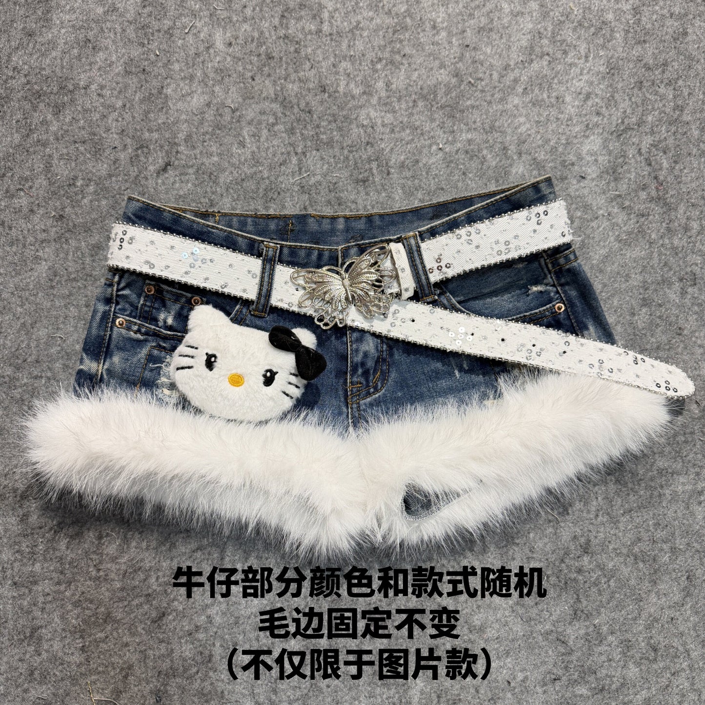 Denim shorts with white faux-fur trim and studded white belt, featuring a panda patch