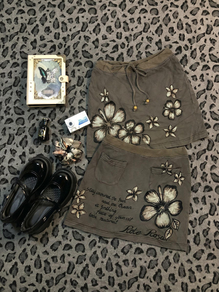 Khaki floral midi skirt with drawstring waist, gold bead ties and butterfly print