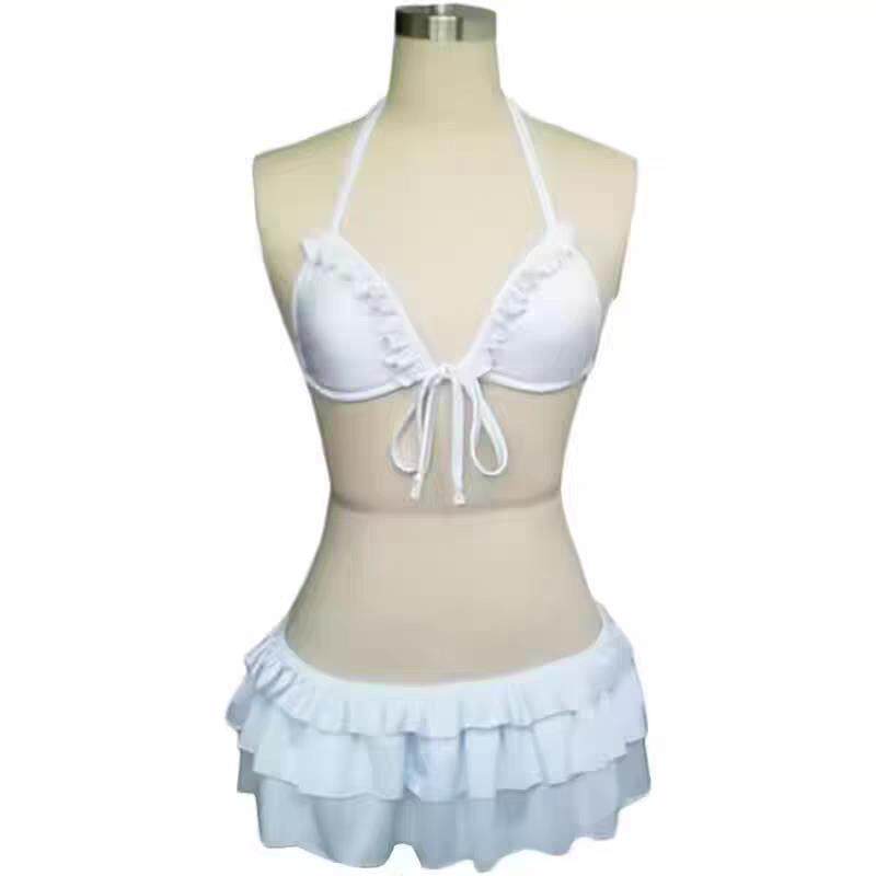 White tie-front triangle bikini top with ruffled mini skirt, halter straps