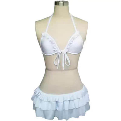 White tie-front triangle bikini top with ruffled mini skirt, halter straps