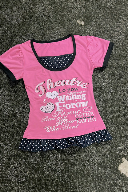 Pink T-shirt with black-trim scoop neck, heart letter graphic and polka-dot ruffle hem