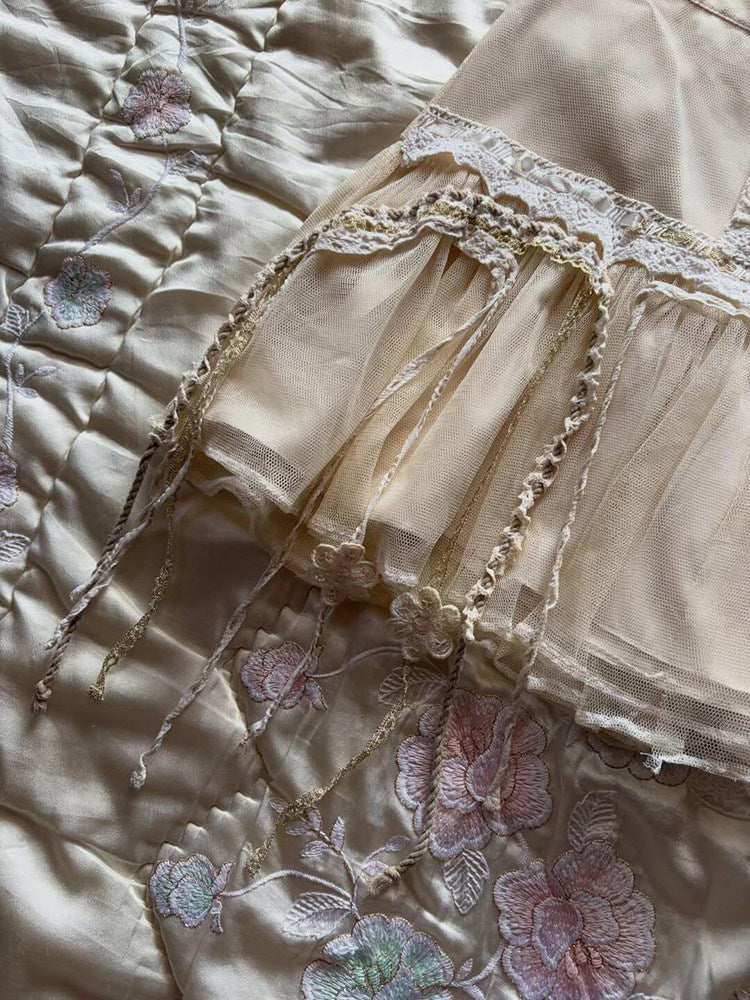 Tiered tulle midi skirt with floral lace appliques and braided trim along hem
