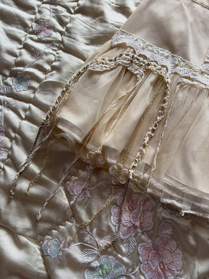 Tiered tulle midi skirt with floral lace appliques and braided trim along hem