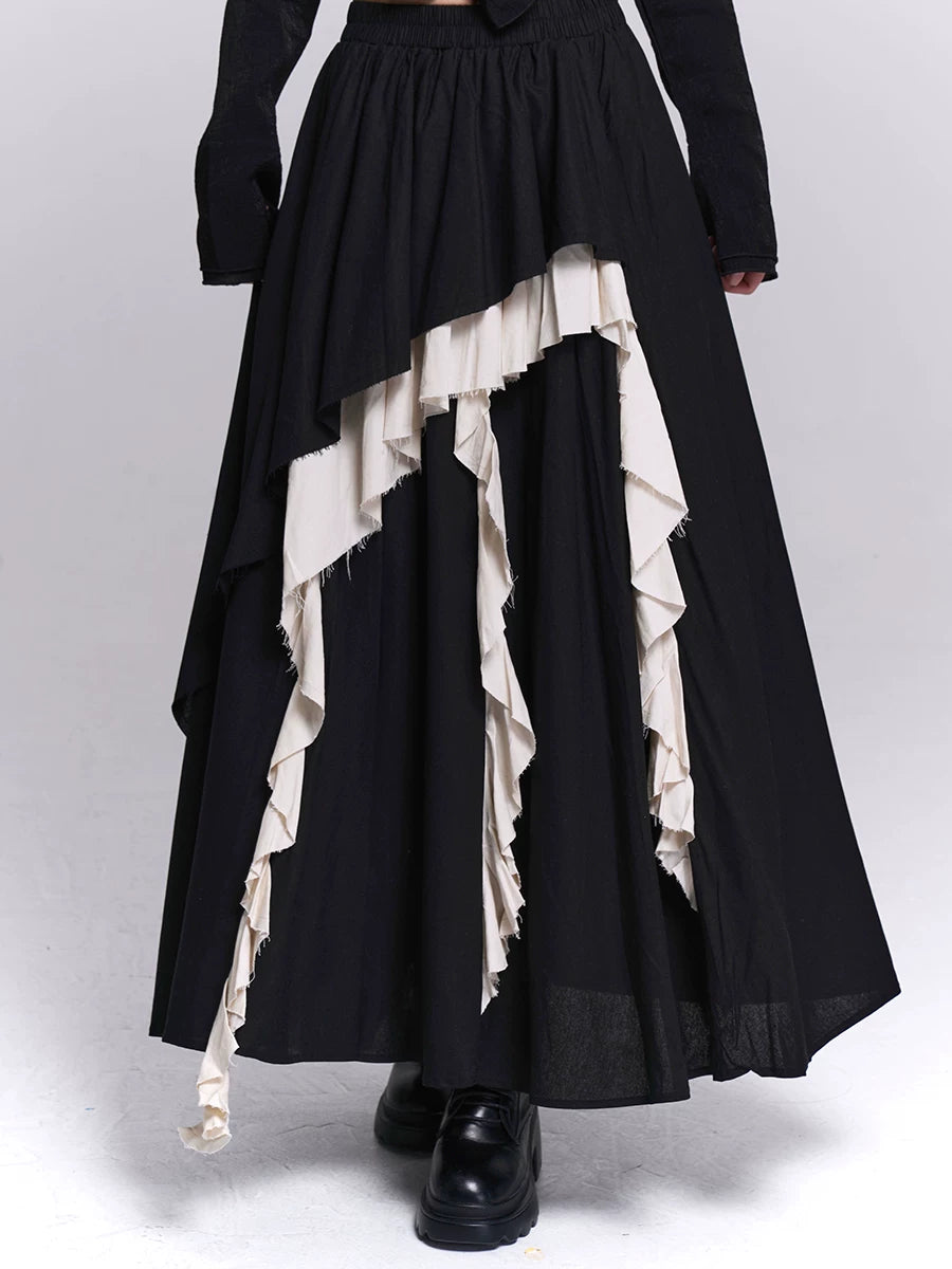 Black maxi skirt with gathered waist and uneven layered ruffle panels in white