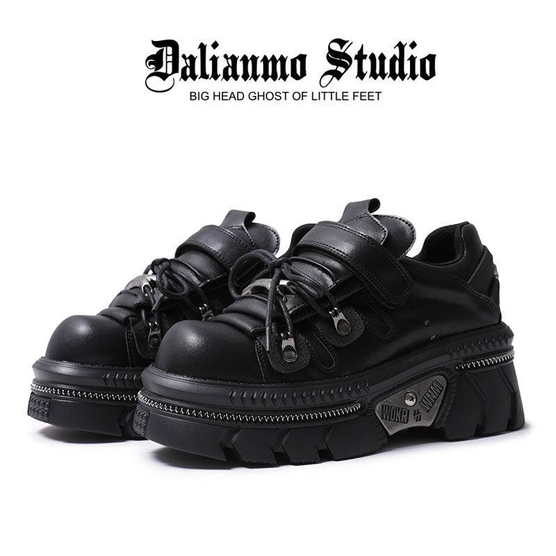 Black gothic platform flats with lace-up front, strap, and chunky lug sole