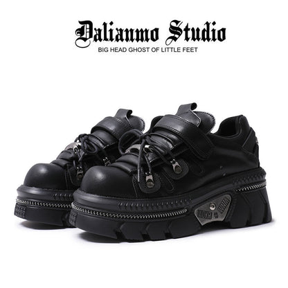 Black gothic platform flats with lace-up front, strap, and chunky lug sole