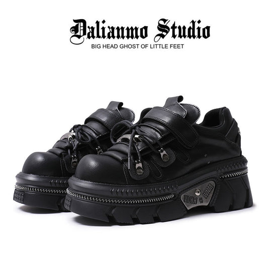 Black gothic platform flats with lace-up front, strap, and chunky lug sole