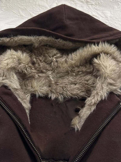 Brown fleece hood lining detail with textured faux fur and front zipper edge