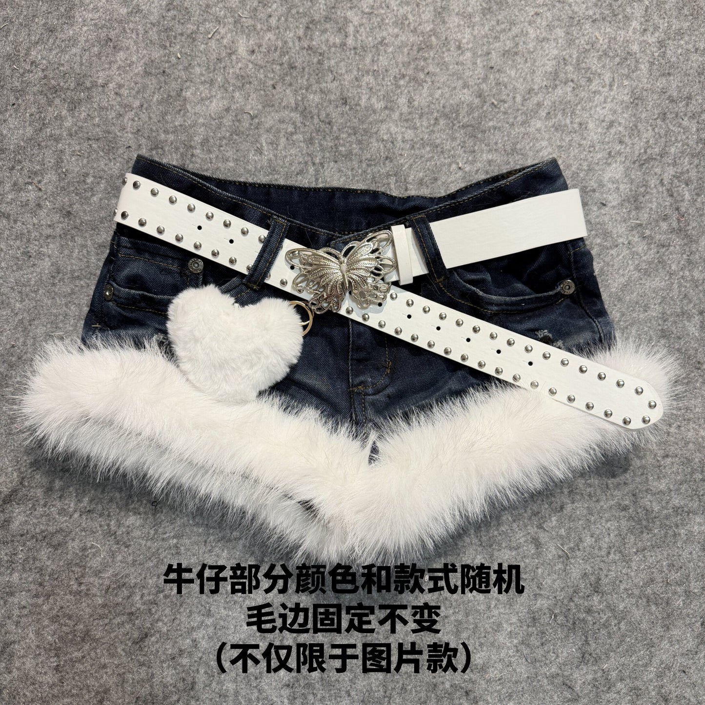 Faux-fur hem denim shorts with silver studded belt and white plush butterfly decor