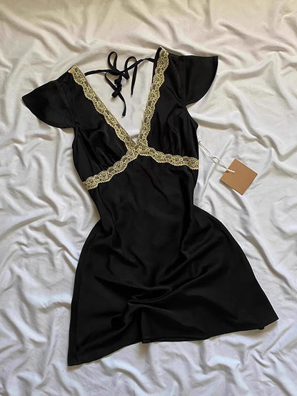Black lace V-neck mini dress with puff sleeves, scalloped lace trim, flared skirt.