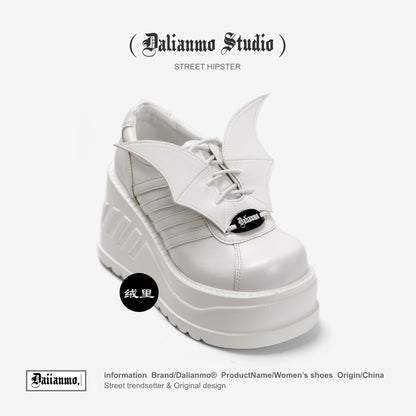 White lace-up platform boots, angled side view, winged side panels