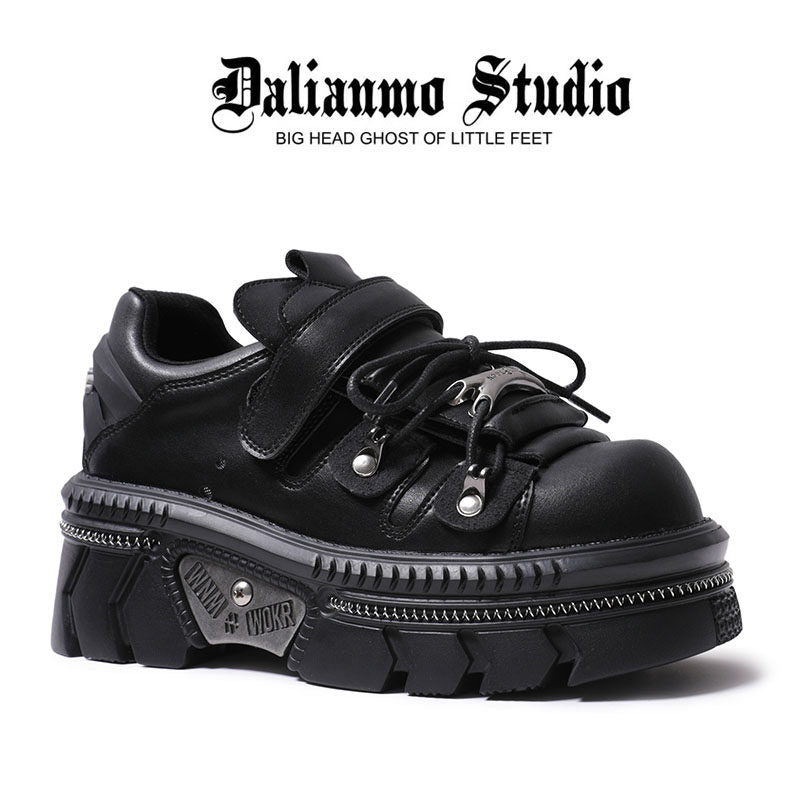 Black platform flats with double strap, lace-up closure, and thick tread sole