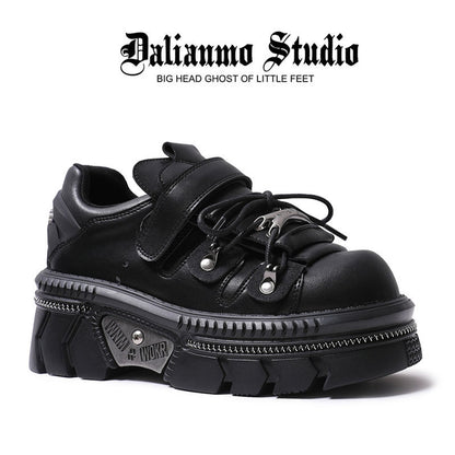 Black platform flats with double strap, lace-up closure, and thick tread sole