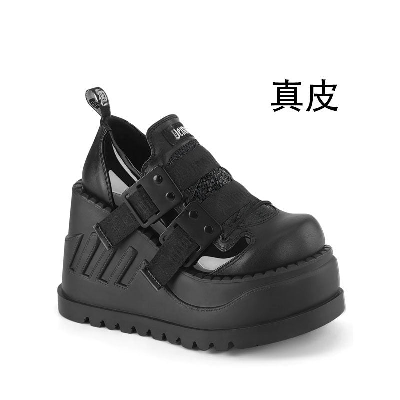 Black platform shoes with double buckle straps and embossed upper panels