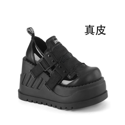 Black platform shoes with double buckle straps and embossed upper panels