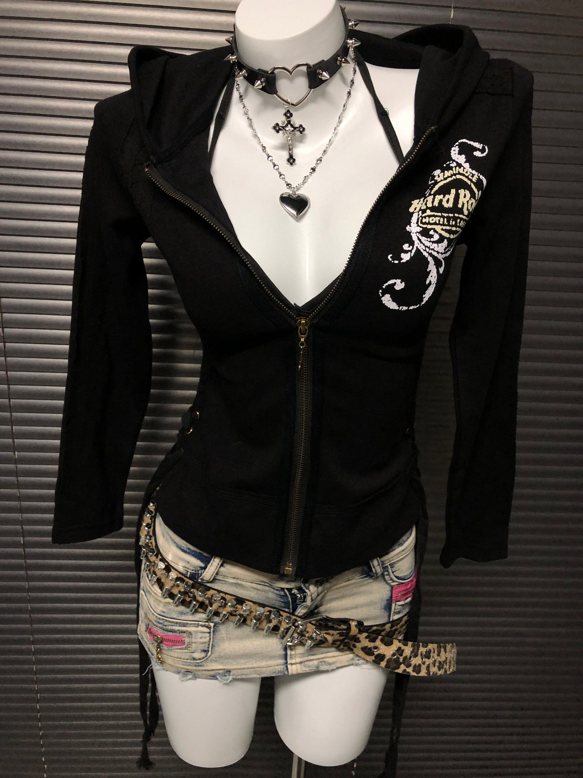 Black zip-up hooded sweatshirt jacket with chest graphic and gold zipper