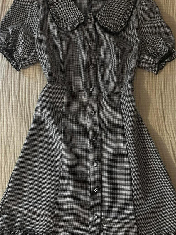 Plaid midi dress close-up: doll collar, button front, puff sleeves, gathered waist seams