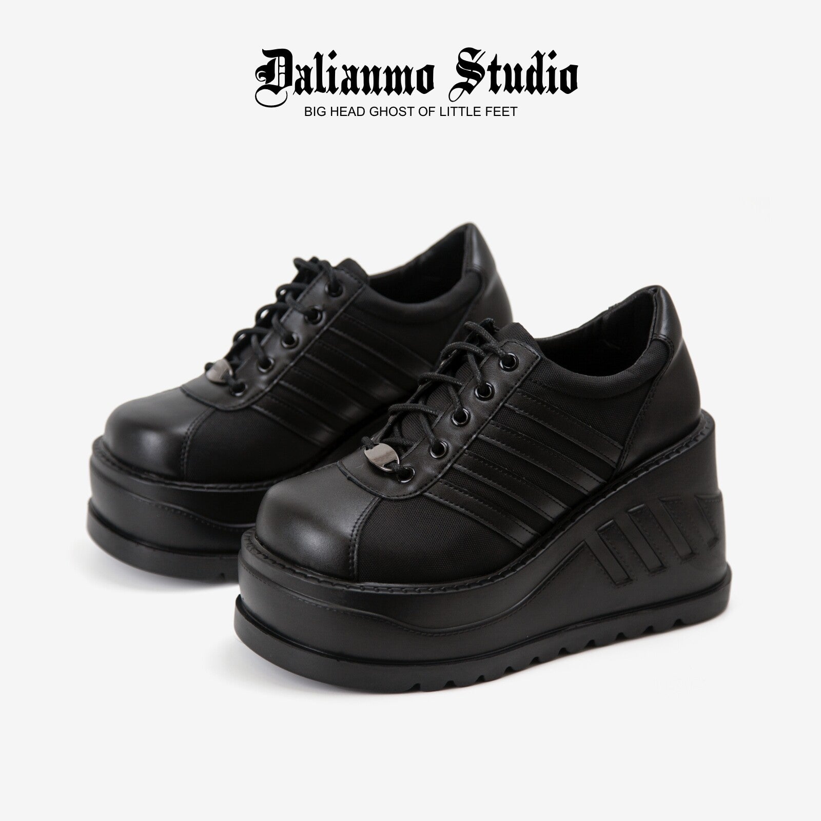 Black platform lace-up sneakers with ribbed stripes and thick tread sole