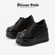 Black platform lace-up sneakers with ribbed stripes and thick tread sole