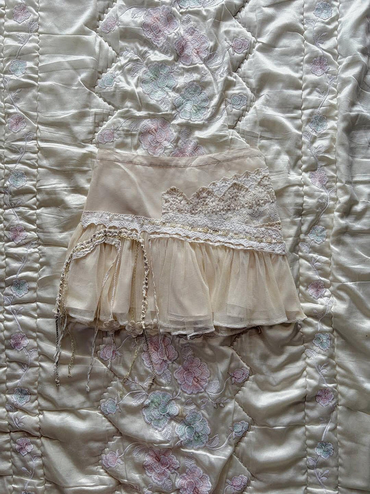 Tiered lace midi skirt with tulle hem and dangling tassel fringe