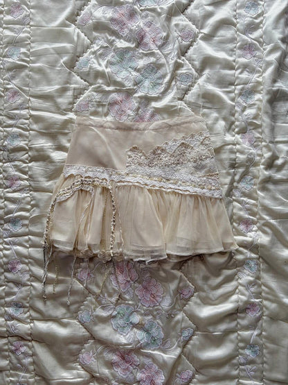 Tiered lace midi skirt with tulle hem and dangling tassel fringe