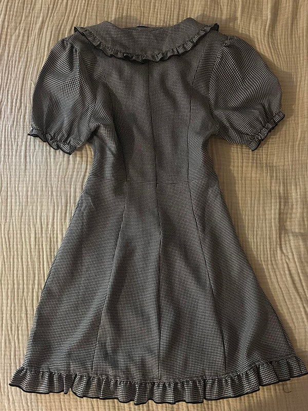 Plaid midi dress with gathered round neckline, short puff sleeves, and ruffled hem