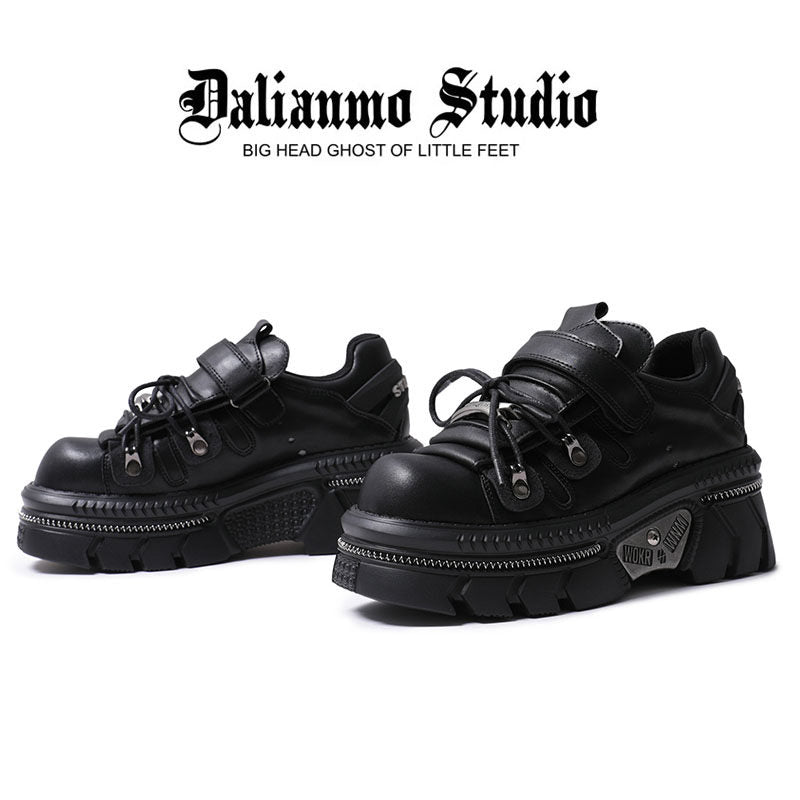 Black gothic platform flats with lace-up, hook strap, and chunky platform sole