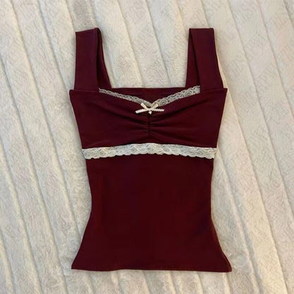 Burgundy camisole slip top with lace trim band and small bow at neckline