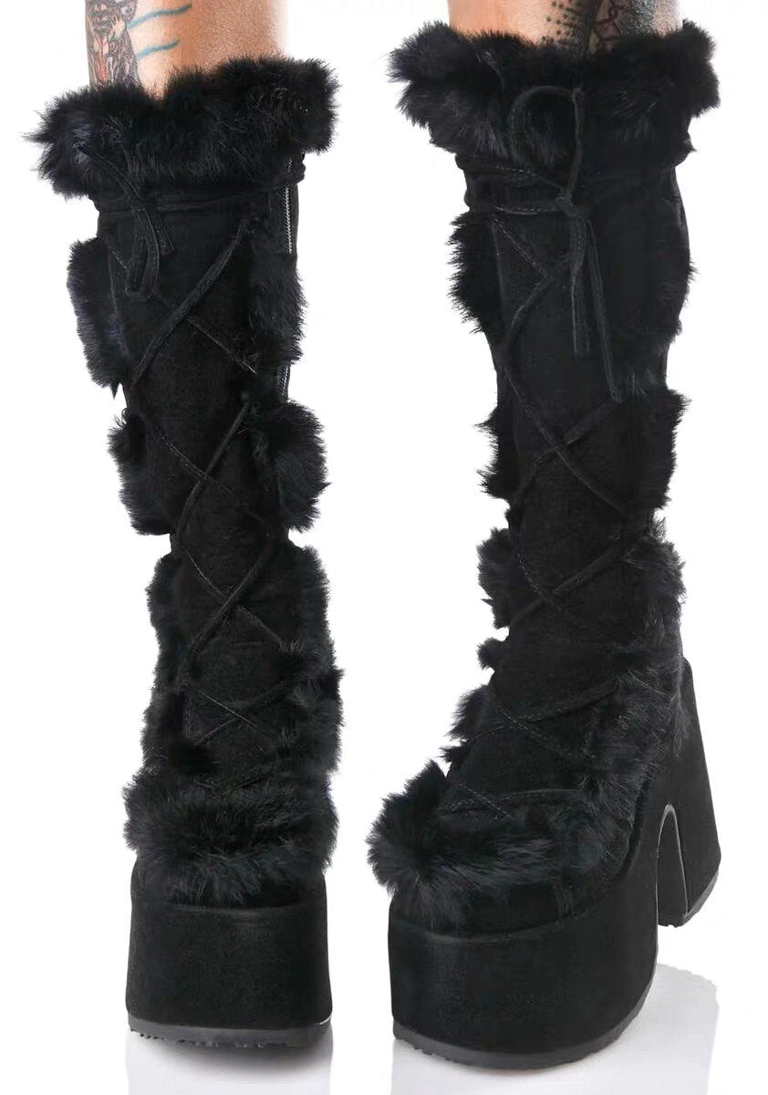 Black platform ankle boots with lace-up detail and shaggy faux-fur trim