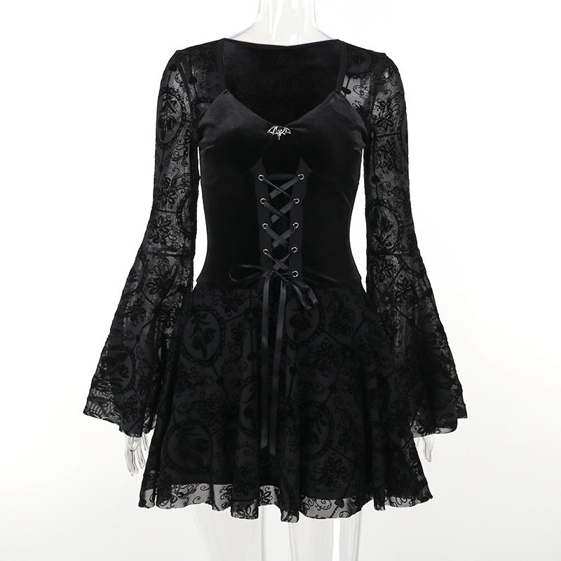 Black gothic skater dress on mannequin: corset lacing bodice, long lace sleeves, flared skirt