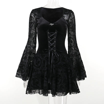 Black gothic skater dress on mannequin: corset lacing bodice, long lace sleeves, flared skirt