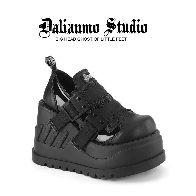 Black platform shoes with double buckle straps and chunky tread sole