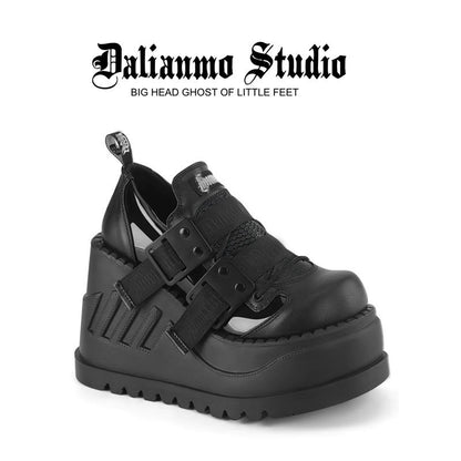 Black platform shoes with double buckle straps and chunky tread sole