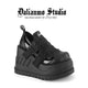 Black platform shoes with double buckle straps and chunky tread sole
