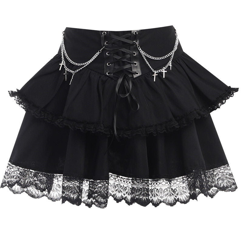 Black layered mini skirt with lace trim, corset eyelet lacing, and cross chains